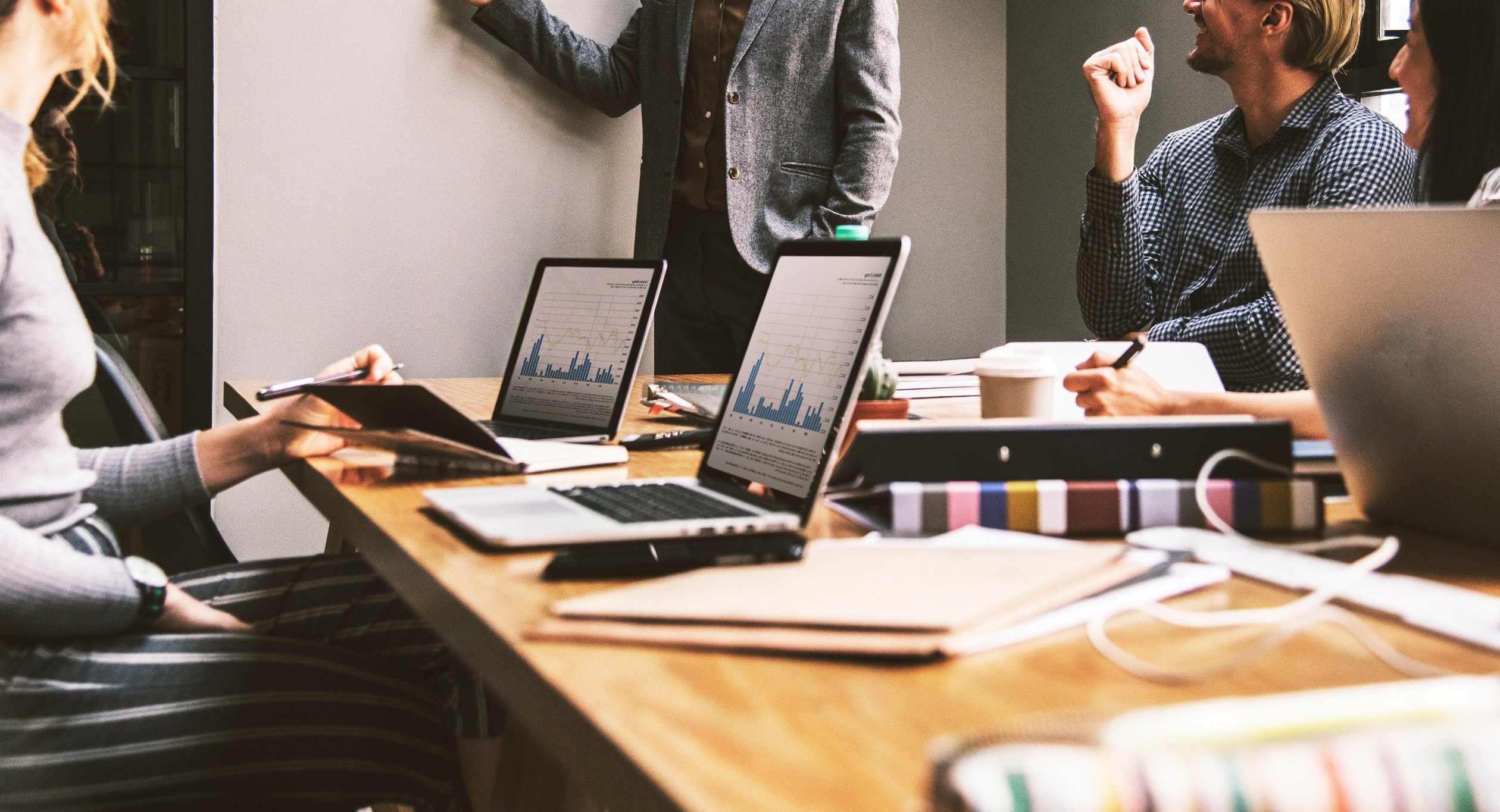 People in a board room holding a business meeting.