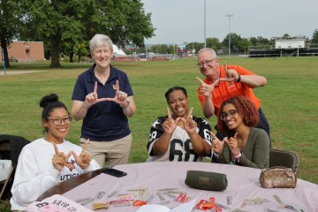 Stephanie Nesbit and Todd Pfannestiel with students at 2024 Involvement Fair.