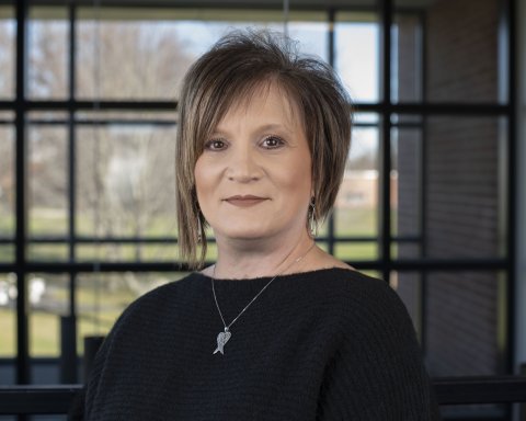 Lisa Rabideau stands in front of a window.