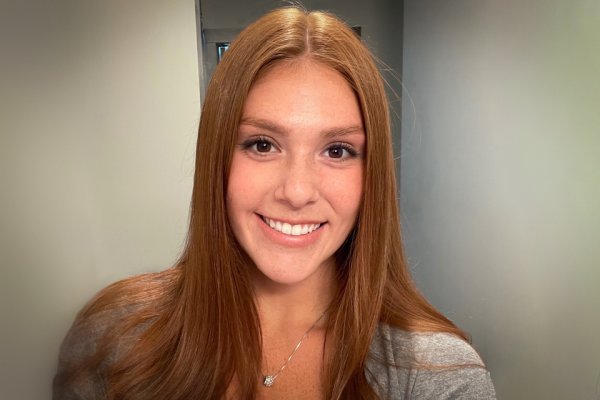 Headshot of Maryanne Lazore '21, smiling at camera in hallway.